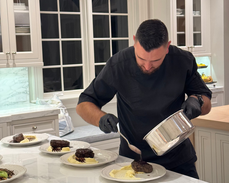 private chef preparing steak with mashed potatoes 