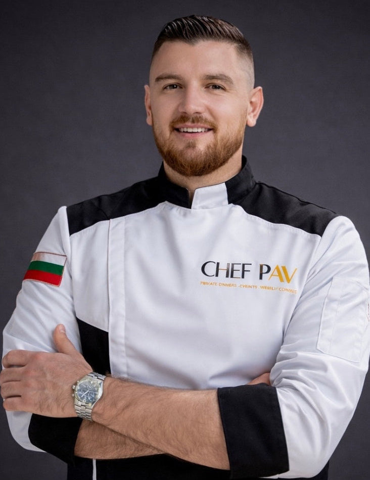 Man wearing a chef's coat with "Chef Pav" logo on a dark background